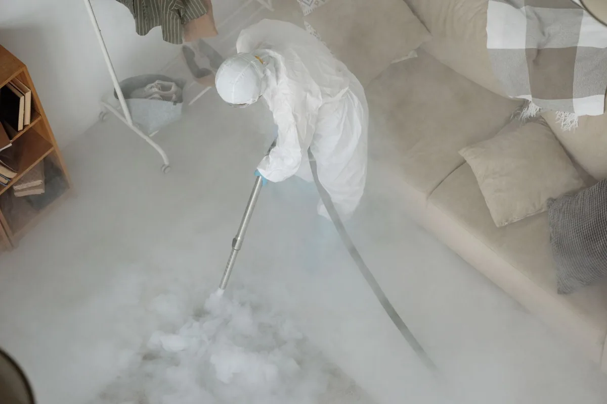 Biohazard cleanup technician in protective equipment, Fort Smith, AR